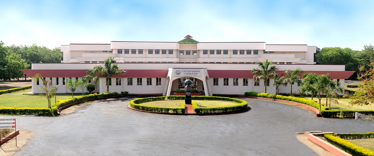 The main academic block with a garden roundabout in front