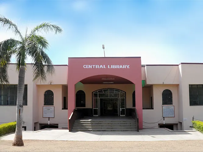 The Central Library building, with a palm tree and steps up to the entrance