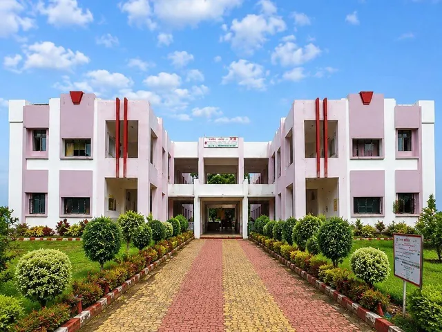 K. V. Patel College of Agriculture, a symmetrical building at the end of a brick-paved garden path